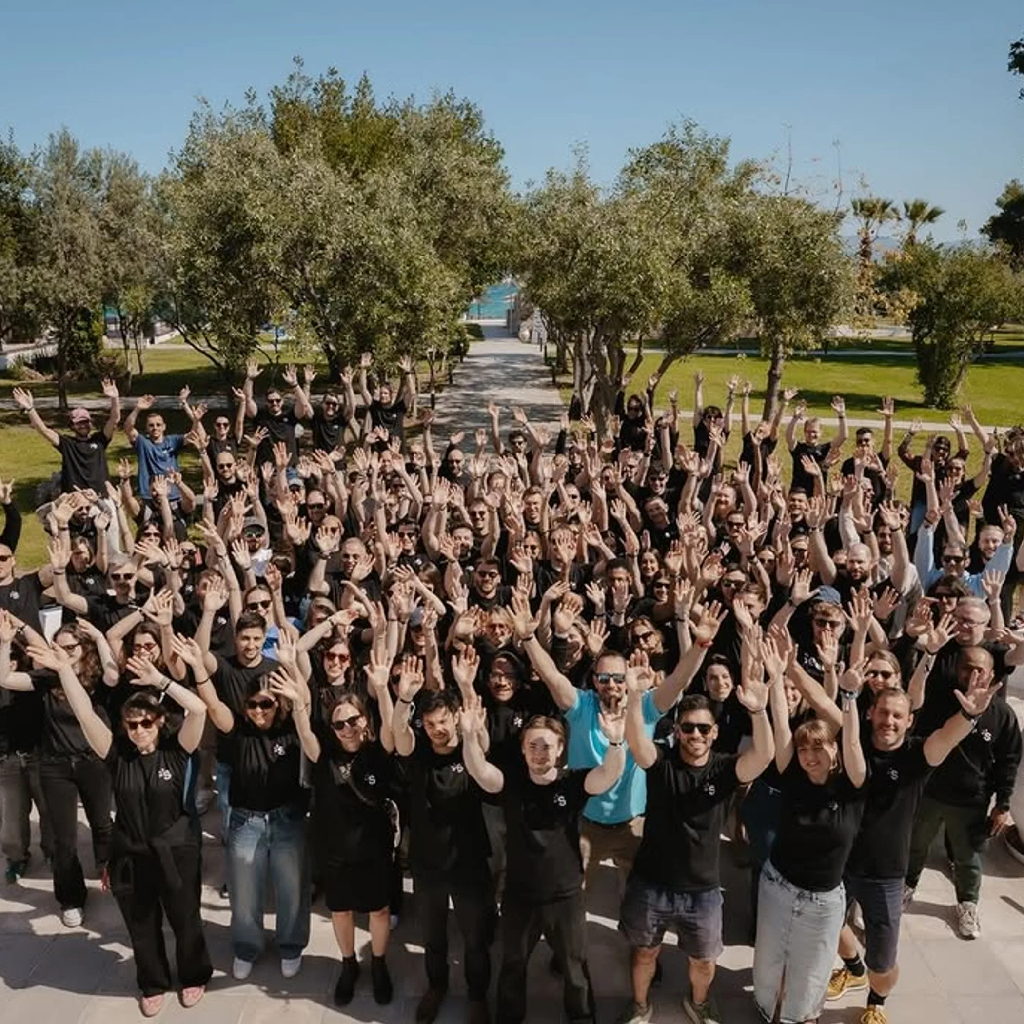 large remote team gathering in person